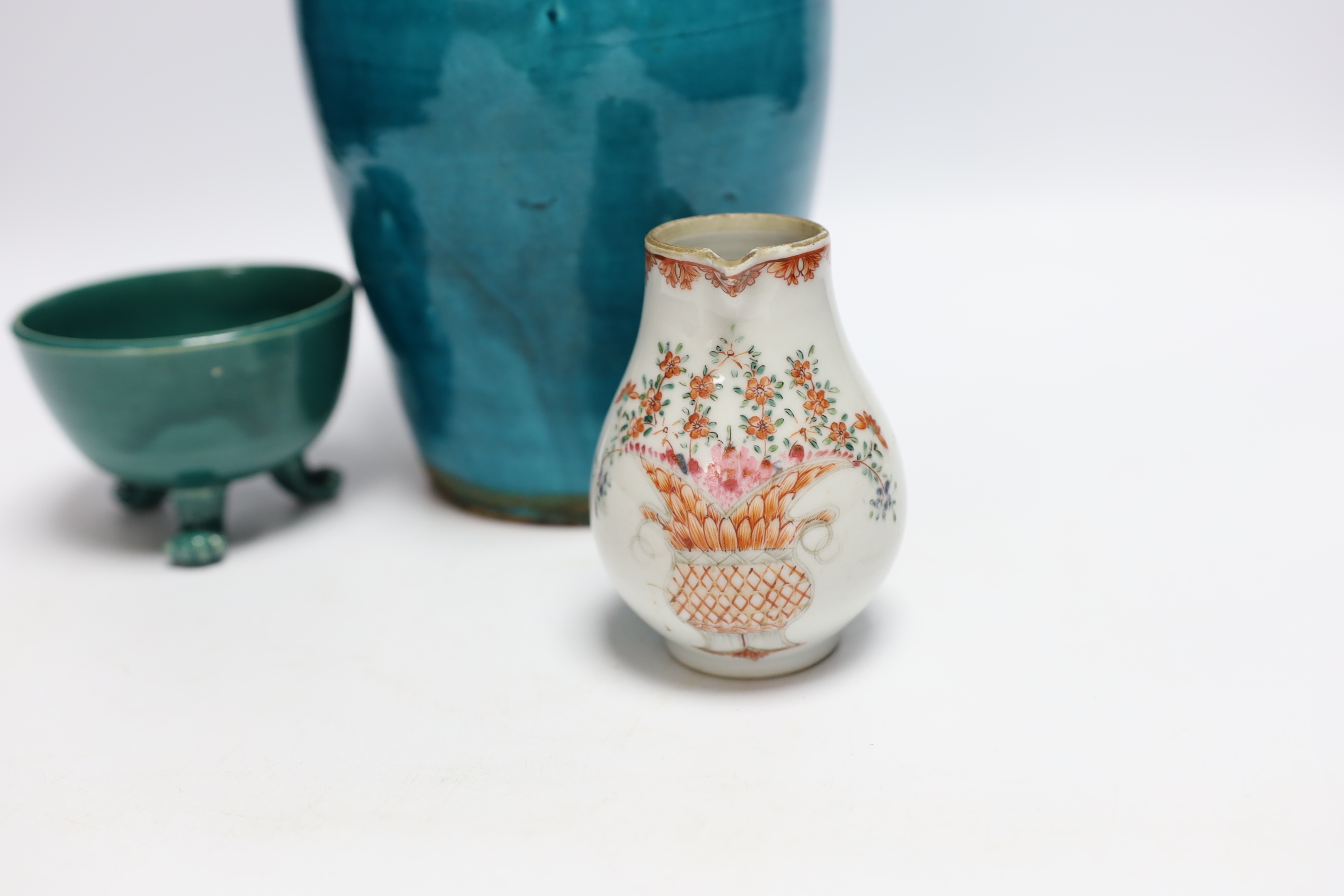 A turquoise glazed three footed bowl and jug and a small Chinese famille rose jug, largest 25cm high